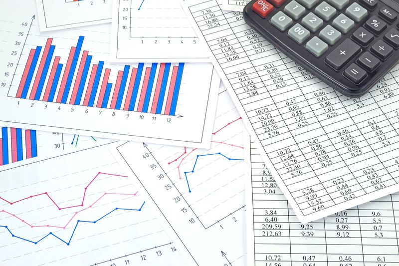 An image of financial tables graphs numbers for work business and economics.