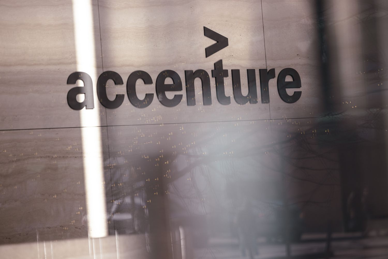 The Accenture logo appears on a wall at the company's office in New York City