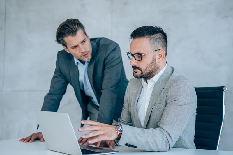 A pair of concerned forensic accountants review the deposit history of an account where there are repeated deposits of over $10,000 being made.