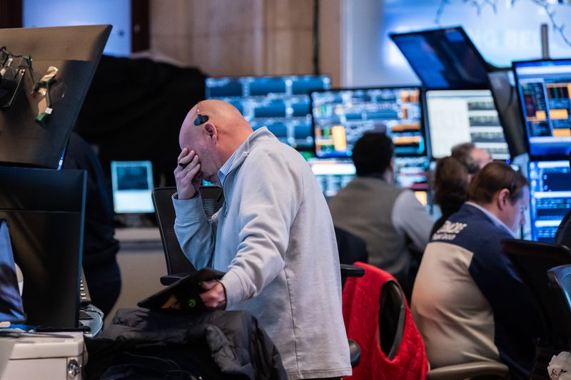 Traders work on the floor of the New York Stock Exchange
