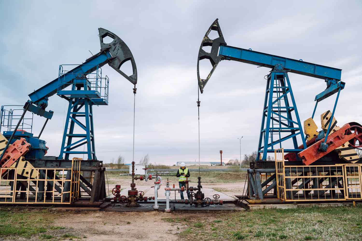 Silhouettes of onshore oil and gas well