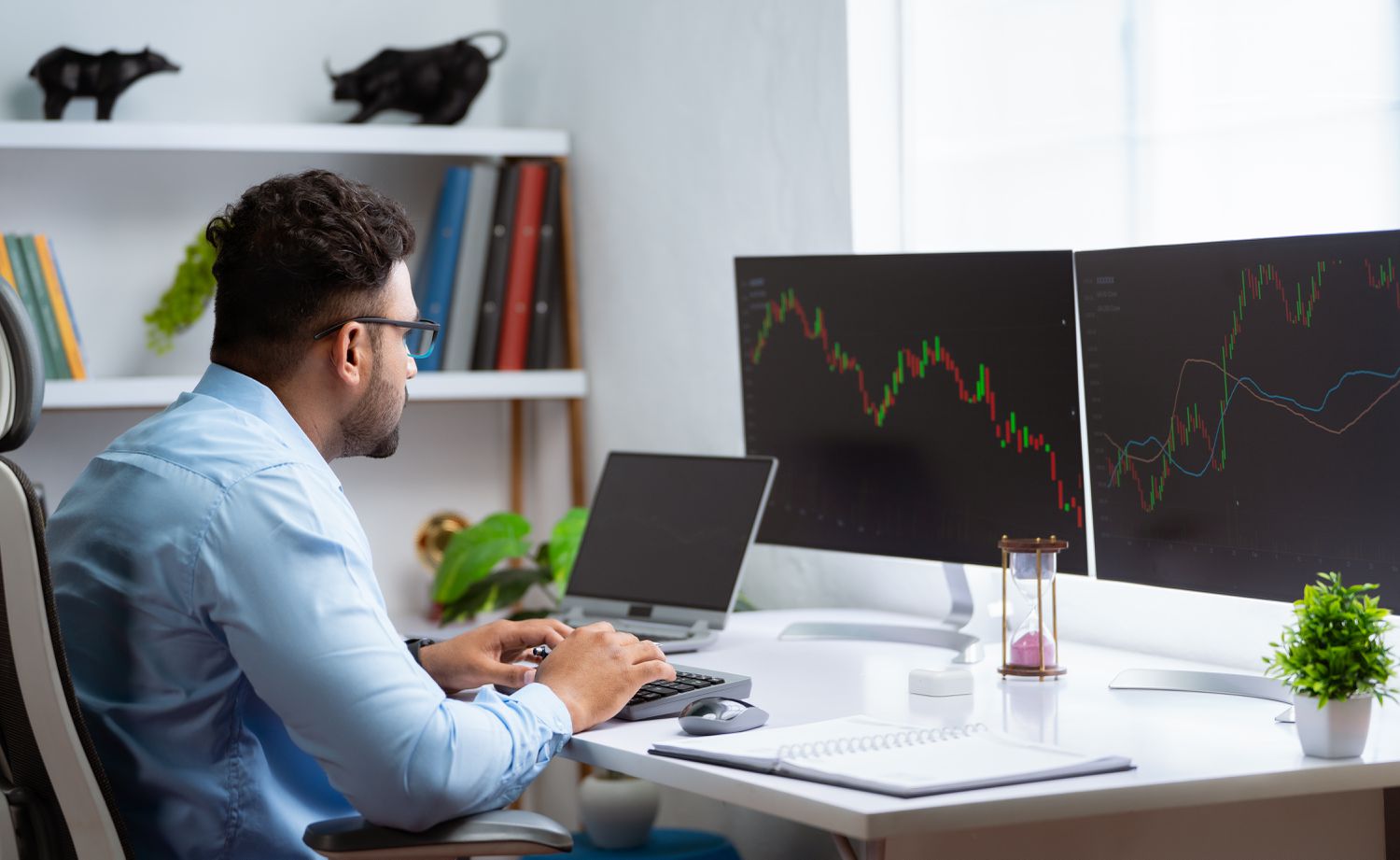Portfolio manager at desk with market charts implementing tactical asset allocation.