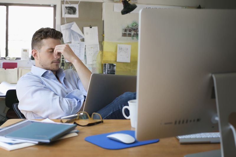 A businessman looking at a computer