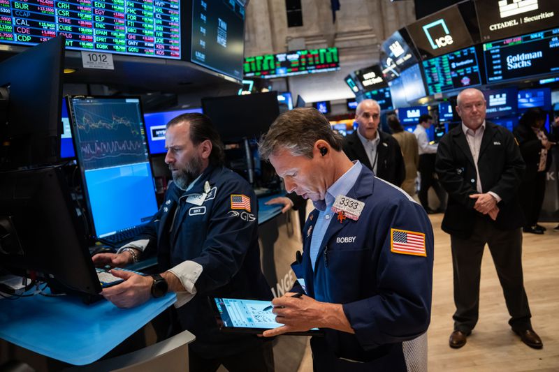 Traders work on the floor of the New York Stock Exchange