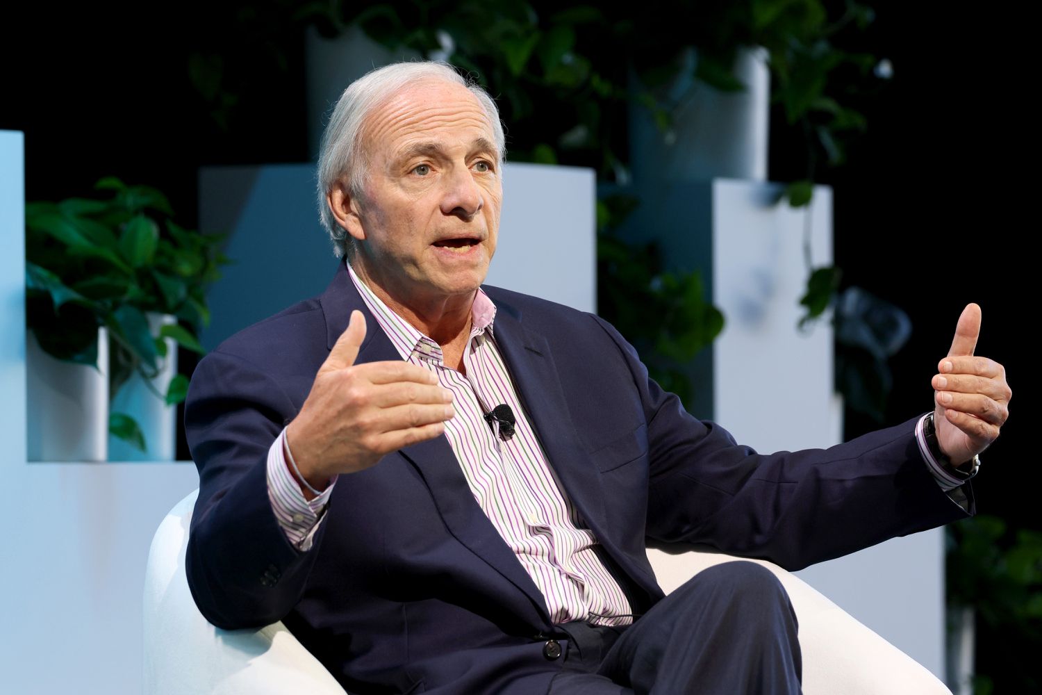 Ray Daliio seated while speaking to a New York City audience in 2024.