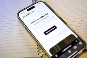 The home page on AppLovin's website is seen on a phone screen.