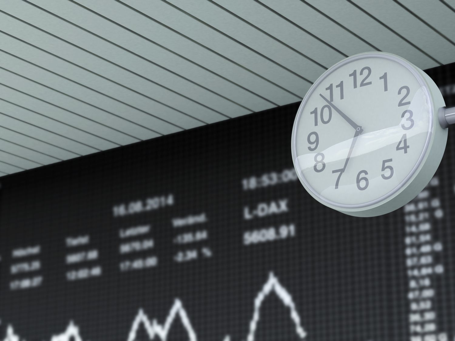 Stock exchange trading and clock in the foreground