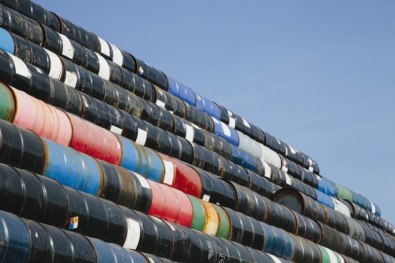 Oil barrels stacked up in layers. Recycling and storage.