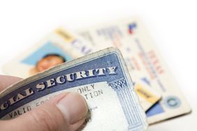 Hand holding Social Security card