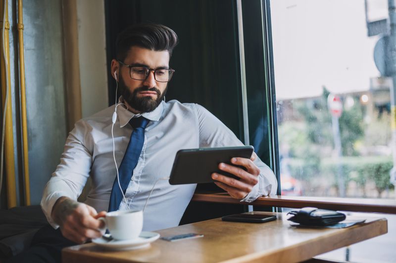 An investor listens to an earnings conference call