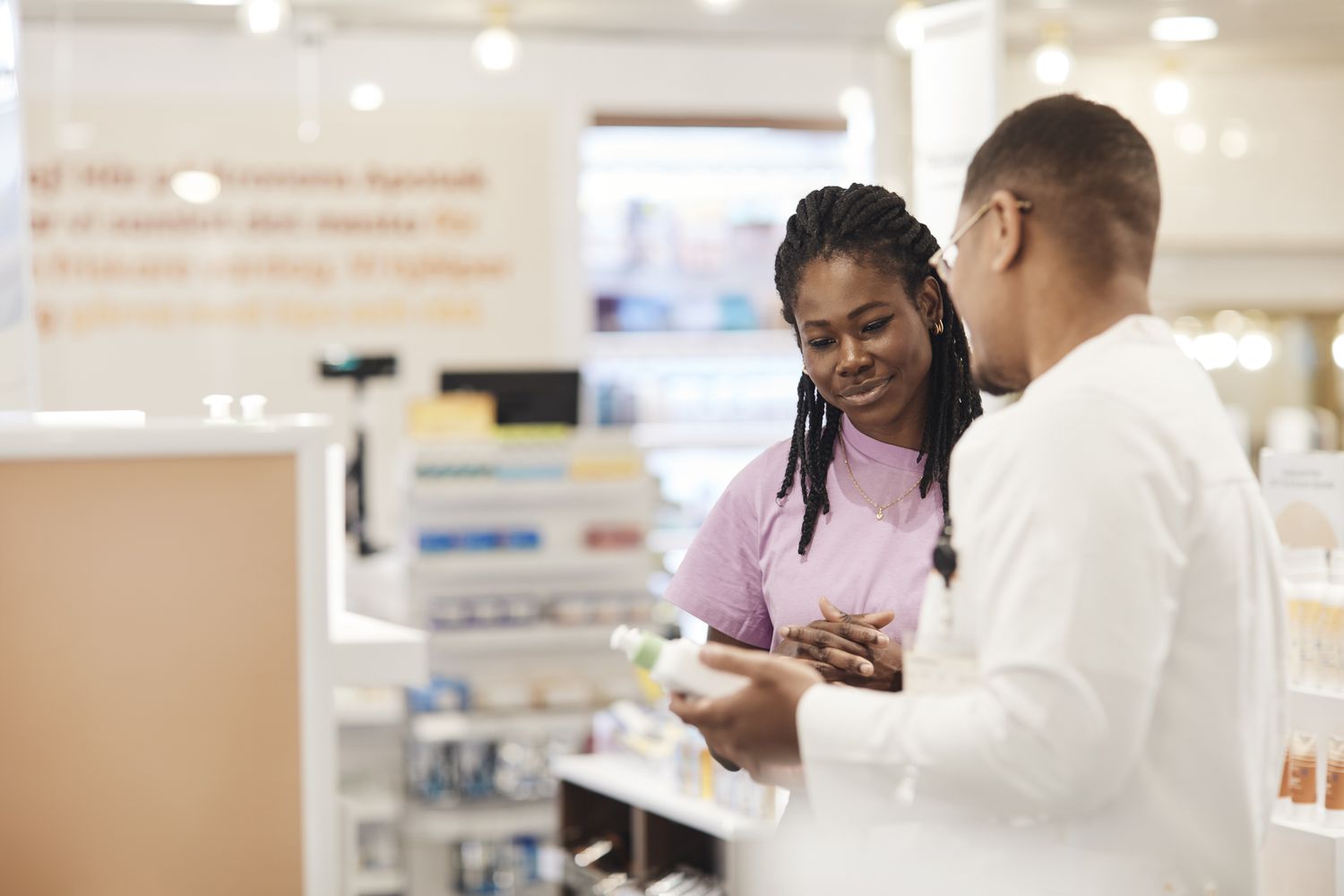 A woman consulting with a pharmacist