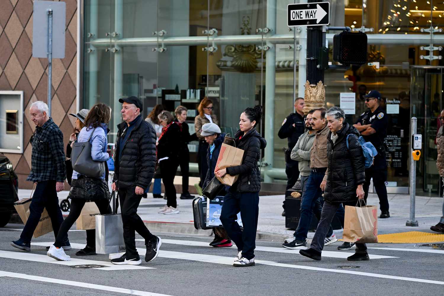 Shoppers carry bags on Black Friday in the Union Square area of San Francisco on Friday, Nov. 29, 2024
