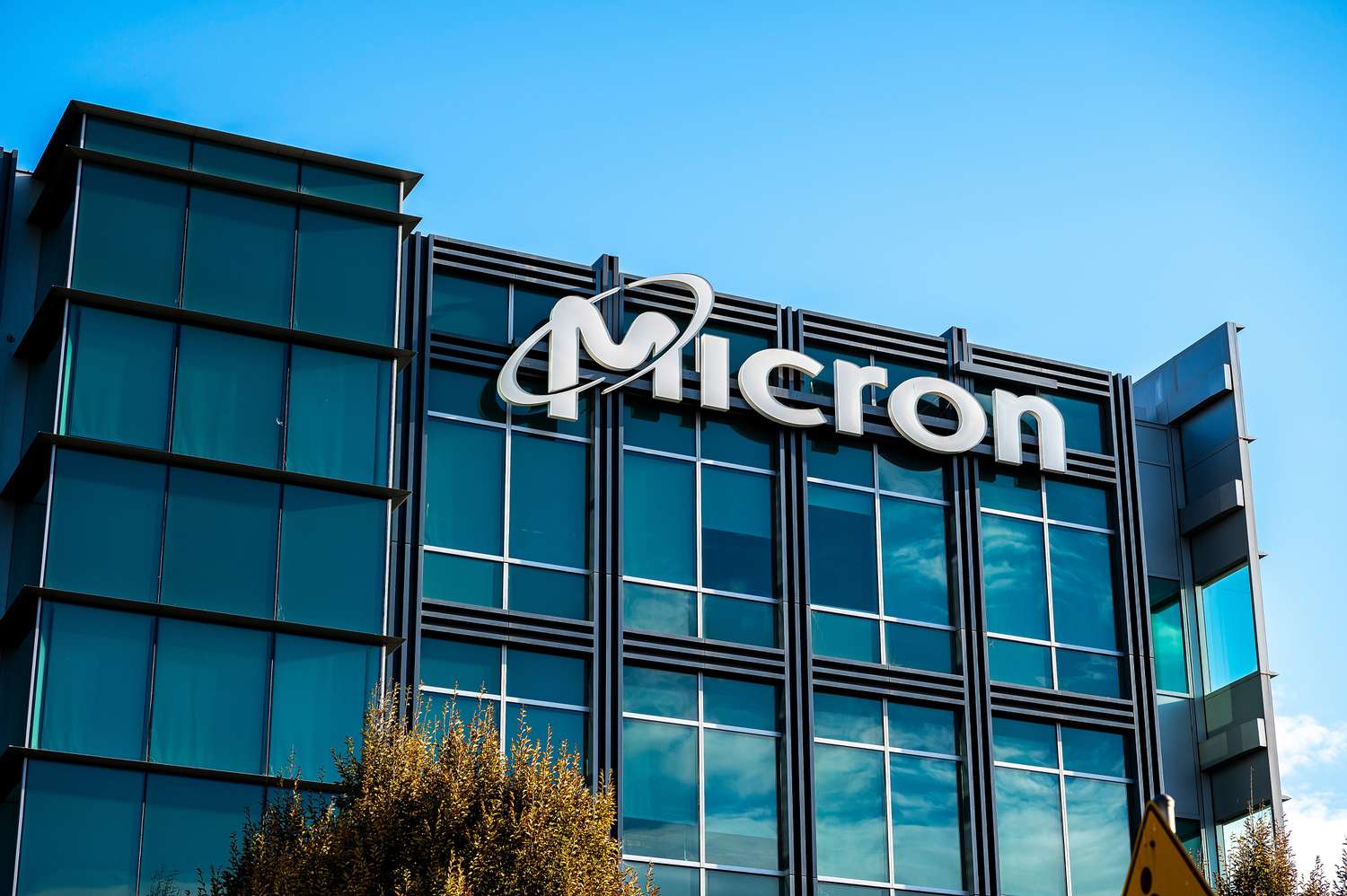 The Micron Technology logo sits on an office building.