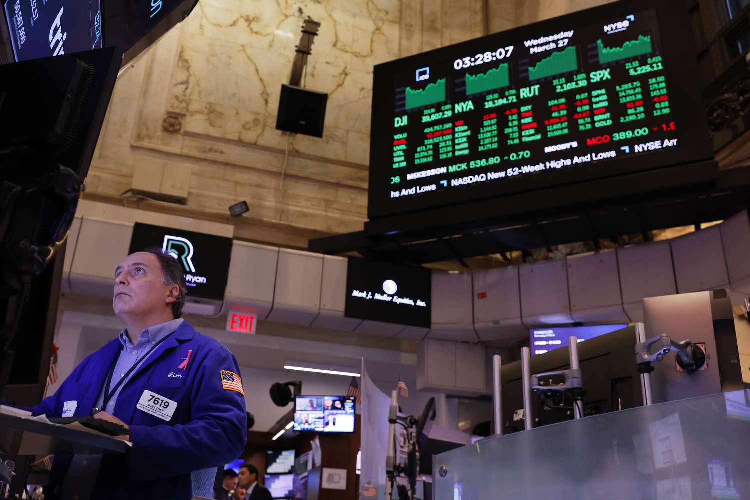 Traders work on the floor of the New York Stock Exchange.