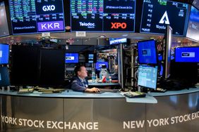 Traders work on the floor of the New York Stock Exchange