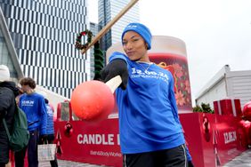 American track star Tara Davis-Woodhall posts at a promotional event for Bath & Body Works' candle sale last week. 