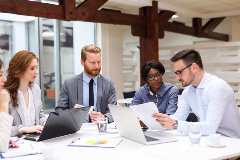 Group of business people is working on new business strategy.