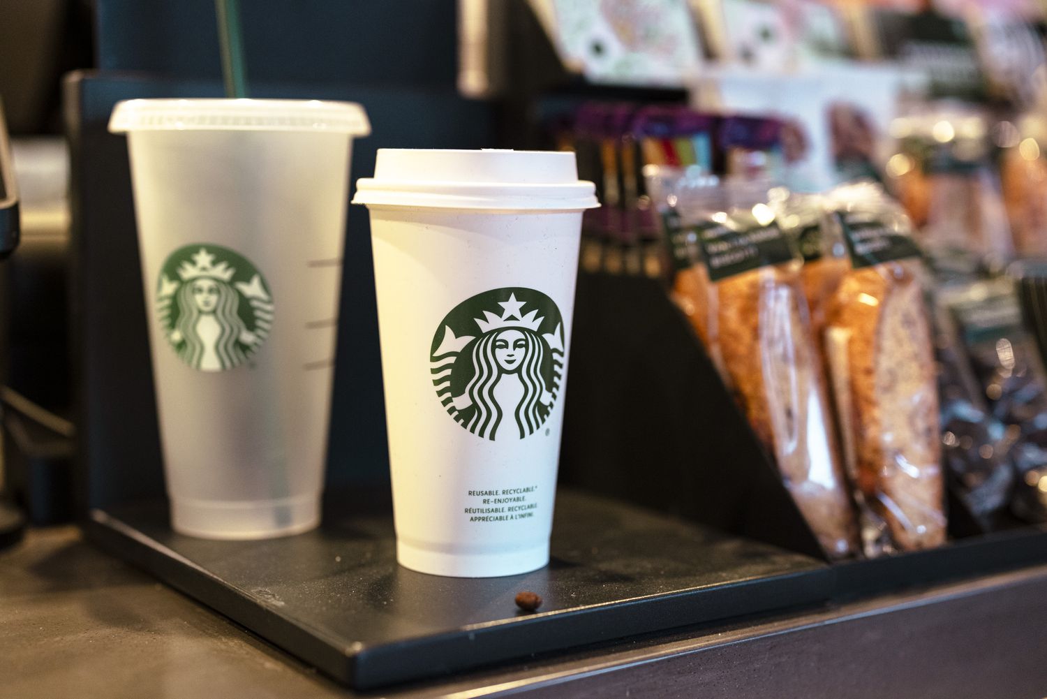 Starbucks cups and other goods at a Starbucks location.