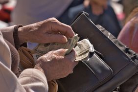 A woman counting money.
