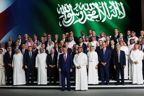 President Donald Trump stands with Saudi Crown Prince Mohammed bin Salman and business leaders in Riyadh, Saudi Arabia