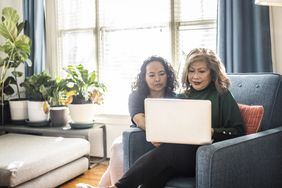 Two women looking at something on a laptop