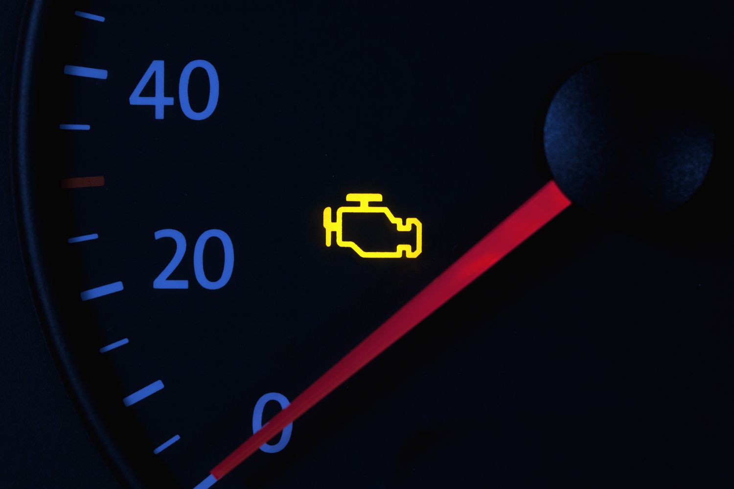 An illuminated "check engine" light in a car