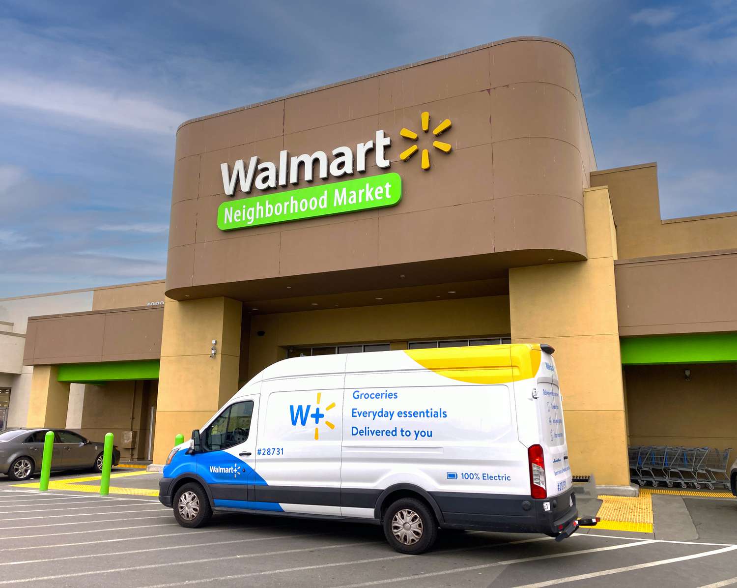 A delivery truck parked outside a Walmart Neighborhood Market