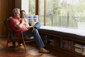 A couple sitting at home