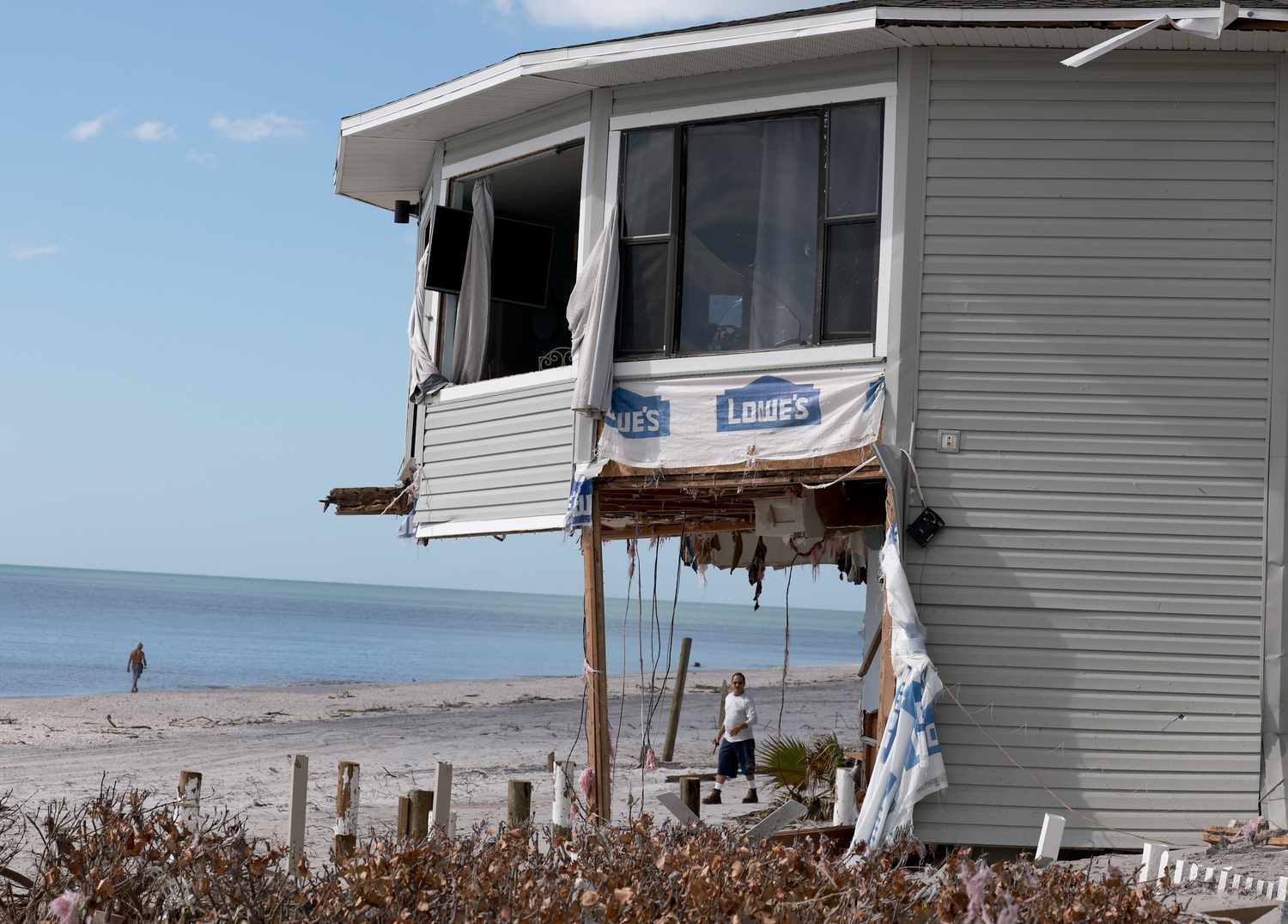 A home that was damaged by Hurricane Milton is seen on October 13, 2024 in Manasota Key, Florida. People continue recovering following the storm that made landfall as a Category 3 hurricane in the Siesta Key area of Florida on October 9th, causing damage and flooding throughout Central Florida.