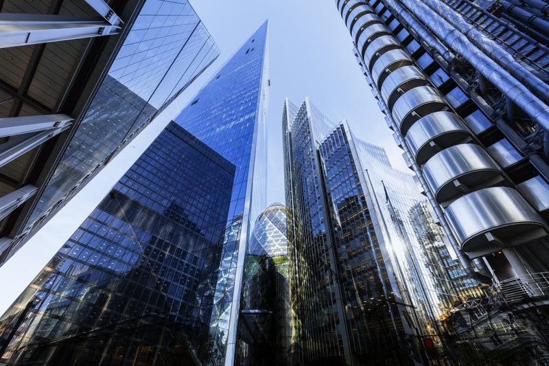 Looking up at futuristic London skyscrapers