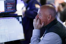 A trader works on the floor of the New York Stock Exchange.