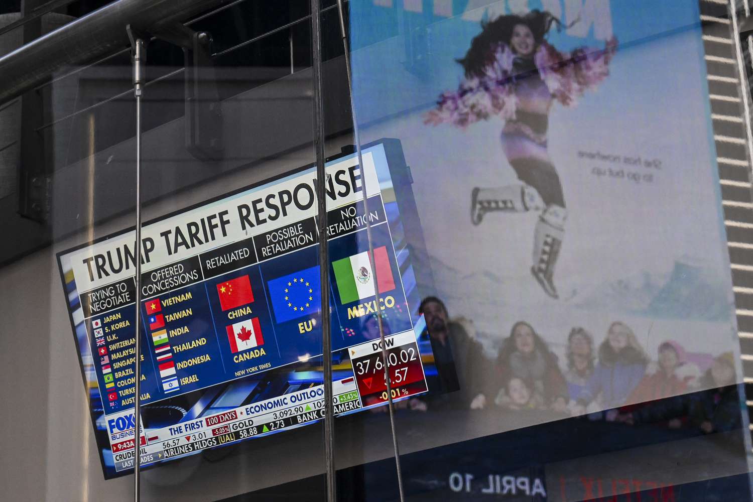 A television screen displays news about the world's response to US President Donald Trump's trade and tariff policies, at the NASDAQ MarketSite in Times Square, New York City on April 9, 2025. 