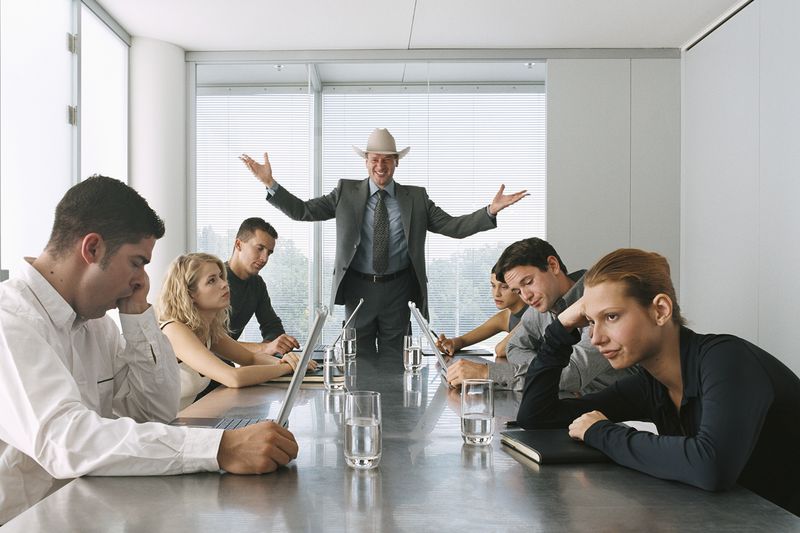 Businessman Talking to Bored Staff in Meeting