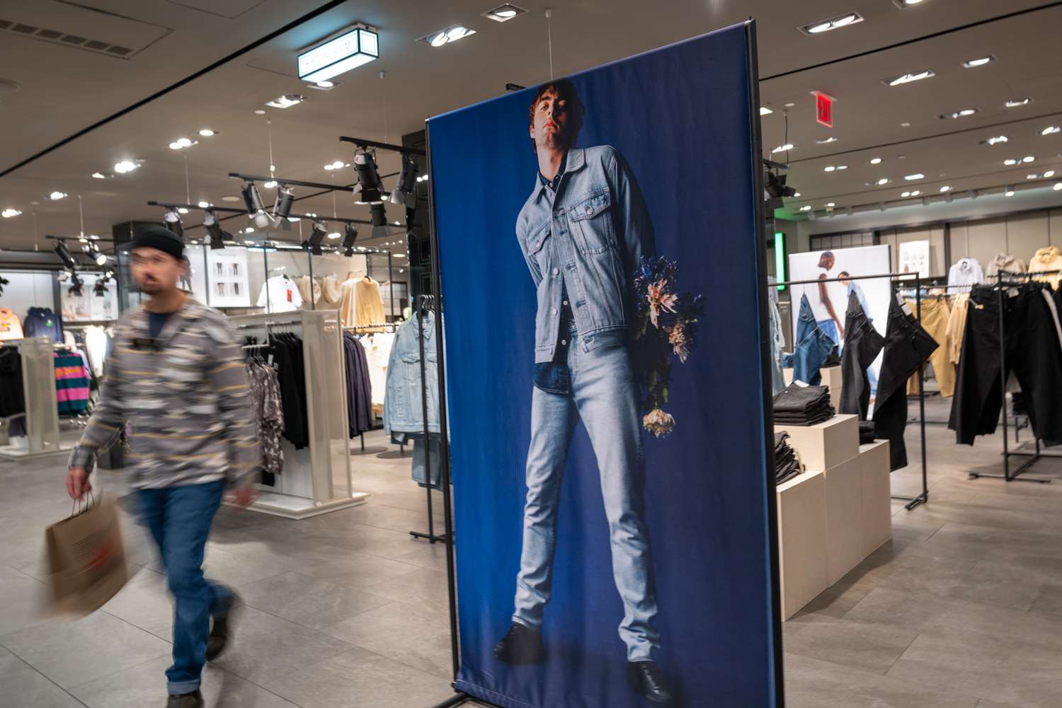 People shop in a clothing store in Manhattan on February 15, 2023 in New York City. The Commerce Department reported Wednesday that retail sales, a barometer of how the economy is doing, rose 3% in January, beating the 1.9% Dow Jones estimate. 