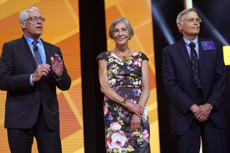 Members of the Walton family (L-R) Rob, Alice and Jim speak during the annual Walmart shareholders meeting event