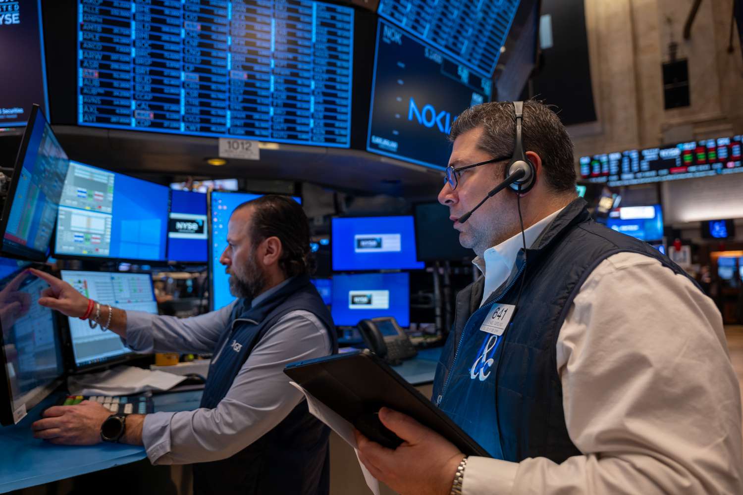 Traders work on the floor of the New York Stock Exchange