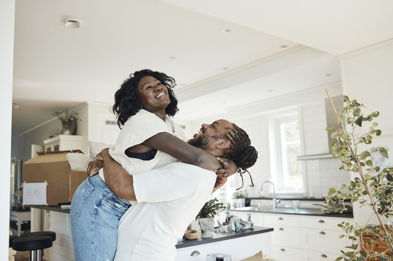 Young homeowners move into their new house.