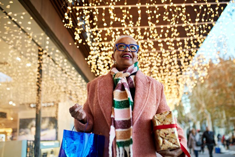 Woman shopping outside with a scarf on