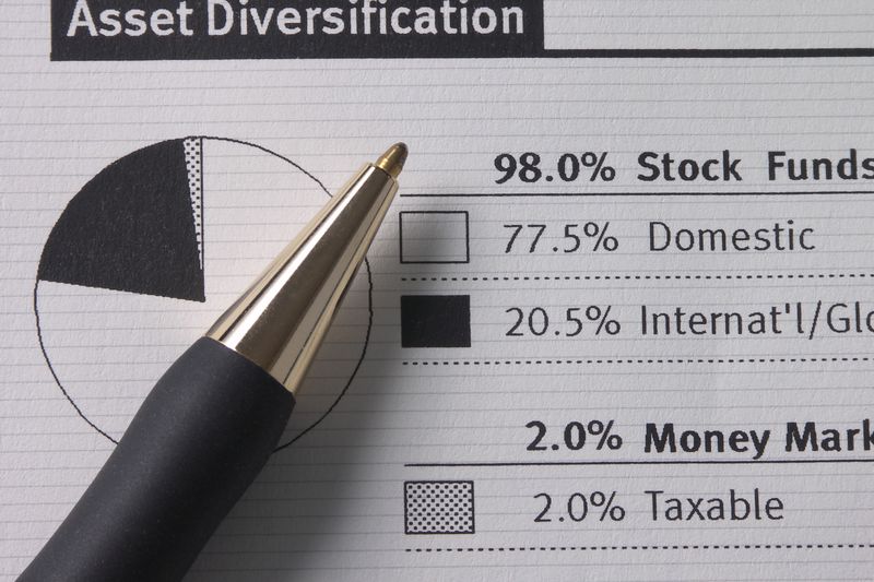 An asset statement showing diversification and pie chart with a pen.