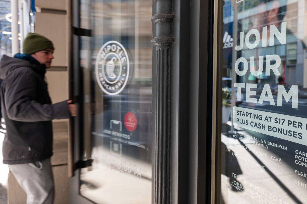 A help wanted sign is displayed outside of a restaurant in Manhattan on January 05, 2024 in New York City.