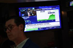 A trader works on the floor of the New York Stock Exchange.