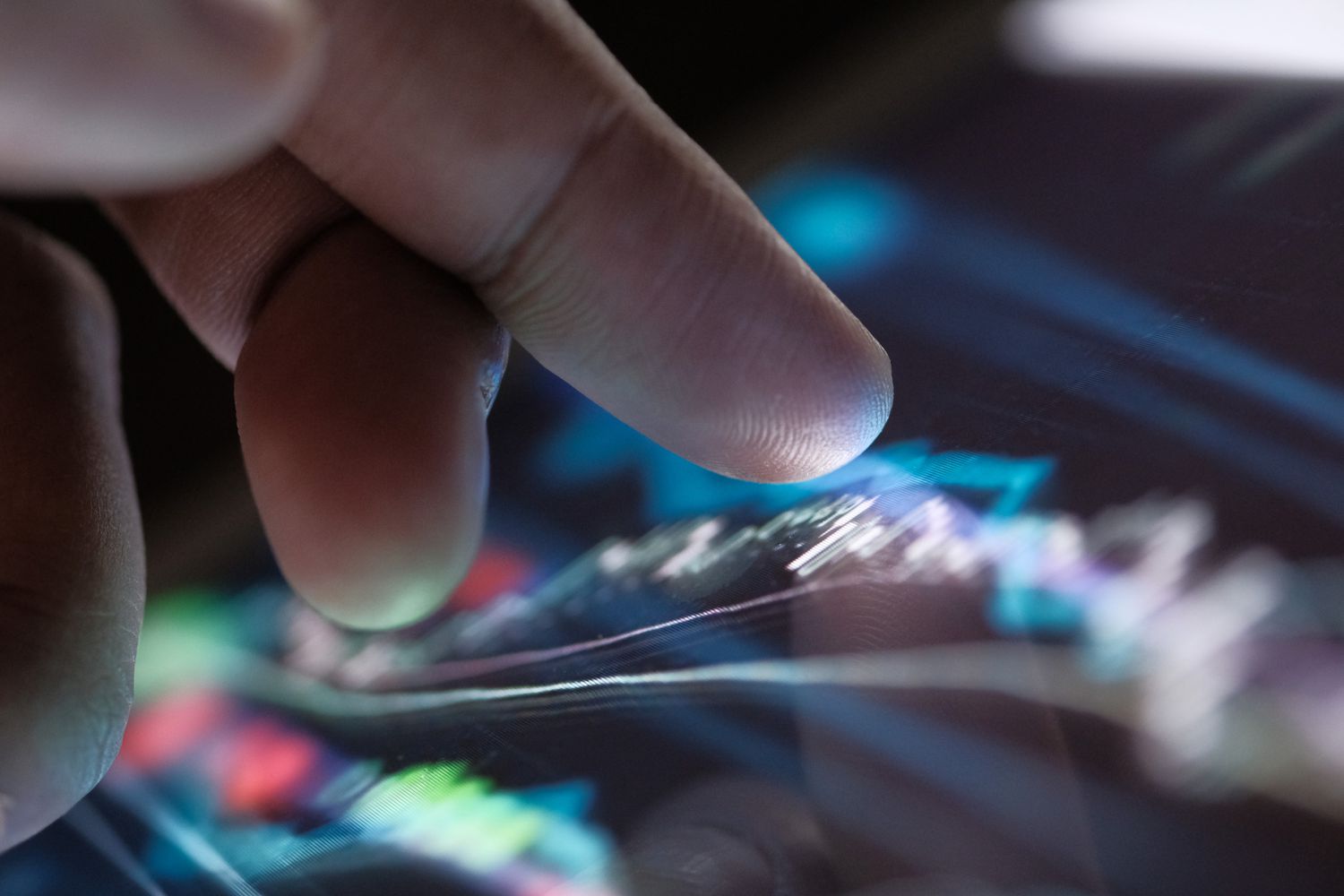 A man hand analyzing stock market chart on digital tablet.