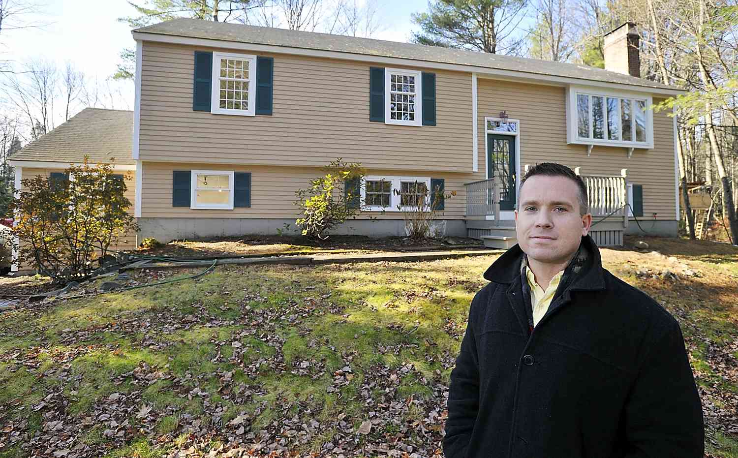 Man standing in front of a house