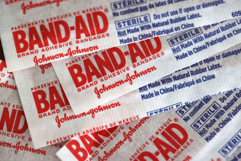 BAND-AID bandages are displayed on a table