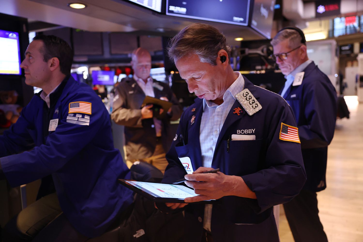Traders work on the floor of the New York Stock Exchange 