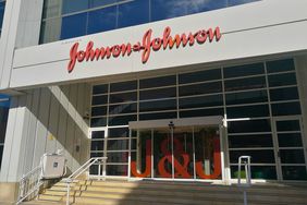 The Johnson & Johnson logo is seen above the entrance to an office building.