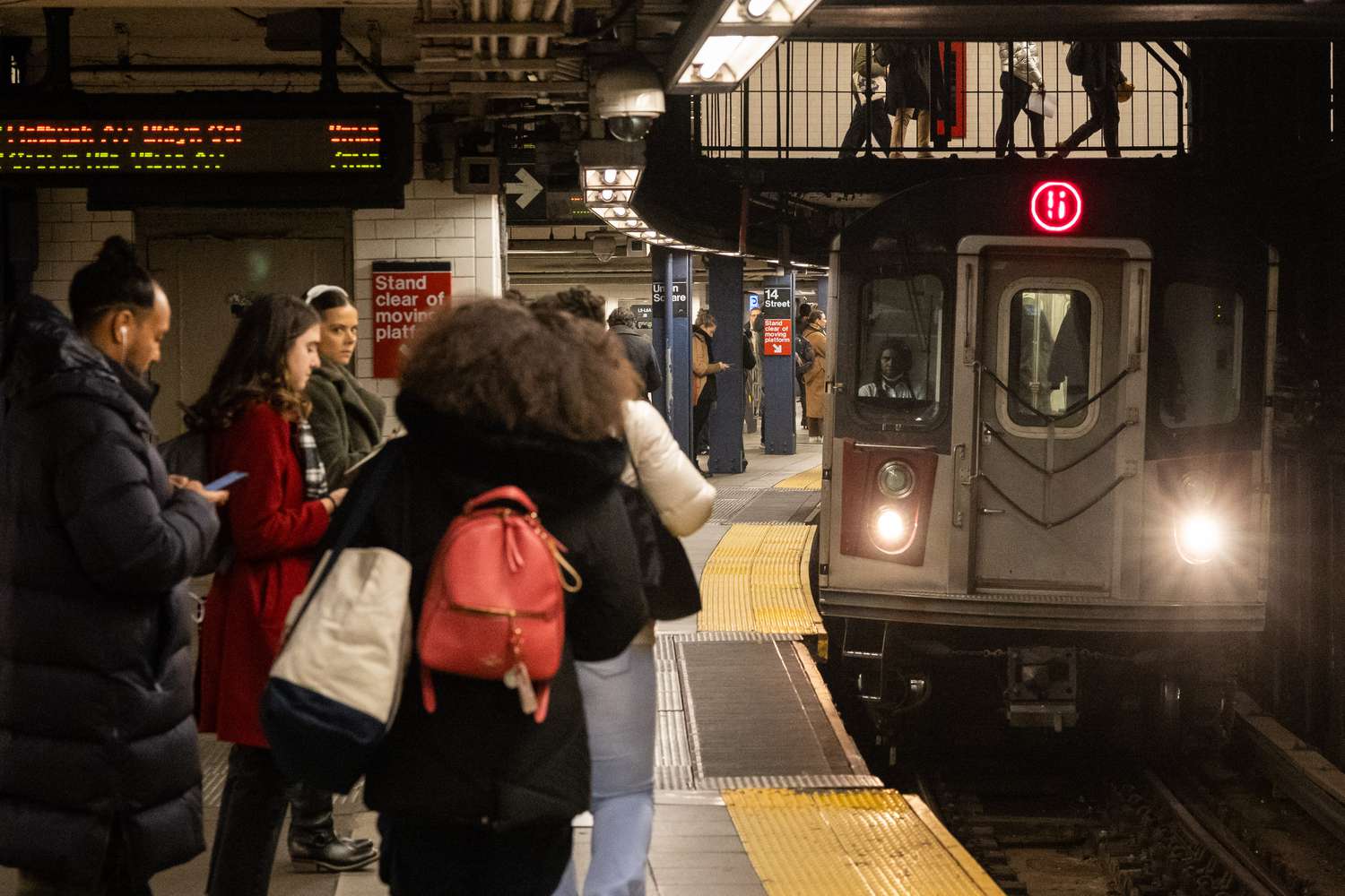 Commuters wait for a train at the Union Square station in New York, US, on Wednesday, Dec. 6, 2023.