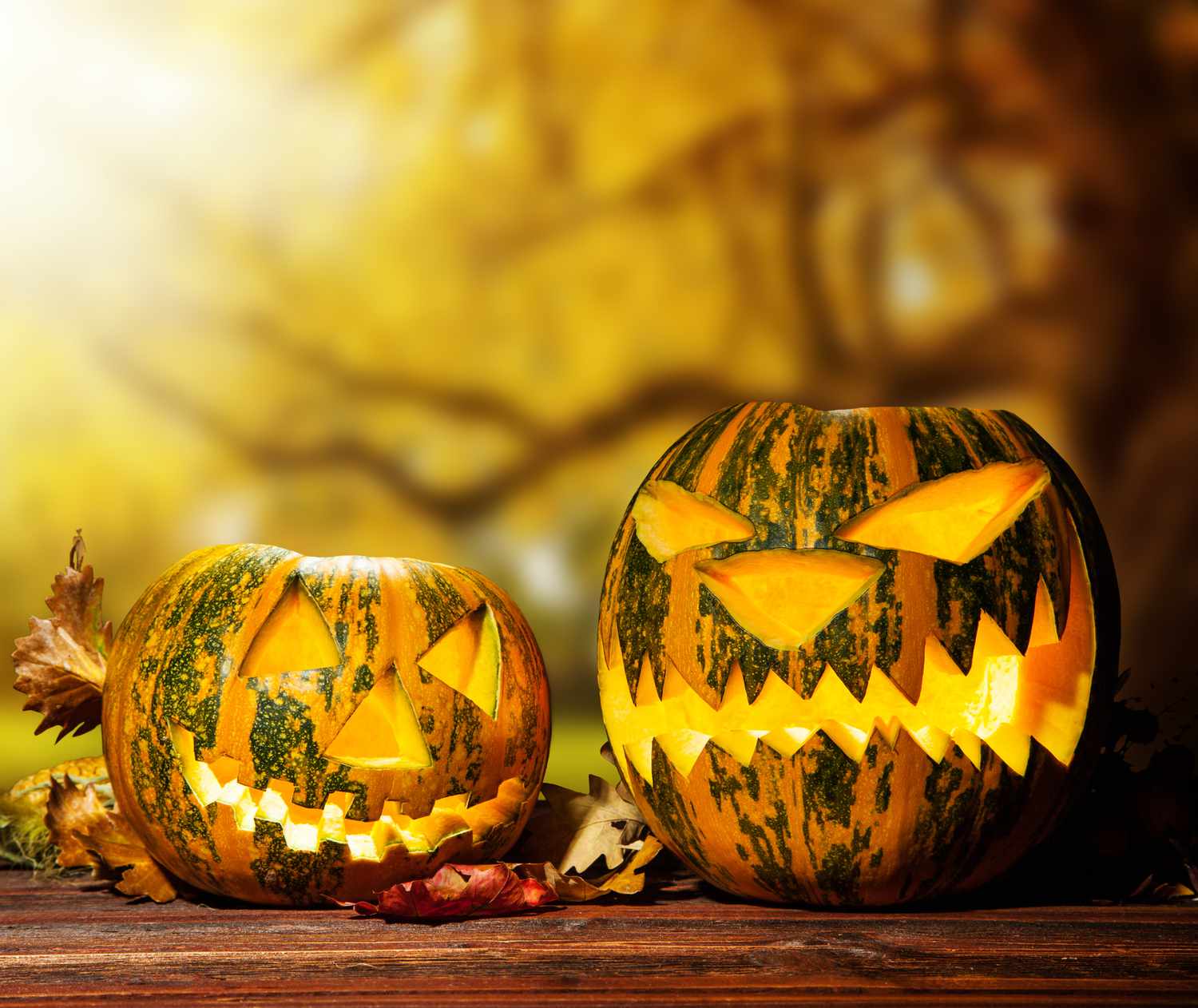 Scary hallowen pumpkin on wood.