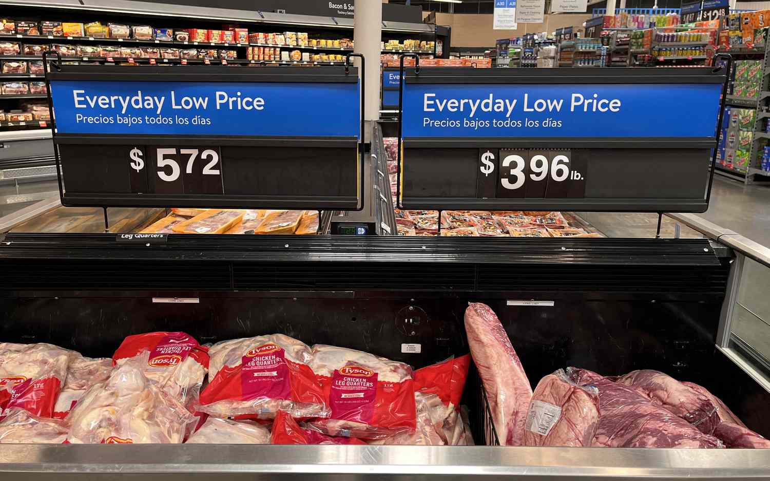 Walmart has signs touting low prices in the grocery section a Houston store. 