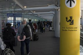 U.S. Customs and Border Protection CBP sign, inscription and symbol in yellow background in Newark Liberty International Airport